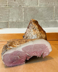 two blocks of ham, with visible fat marbling