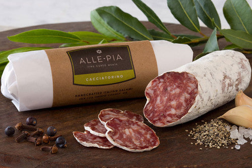stick of salami in it's packaging, and a stick of salami with pieces cut off