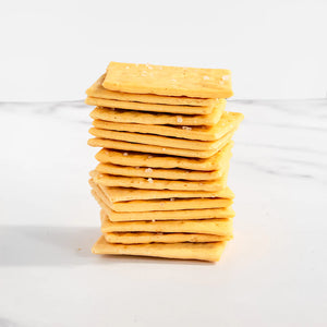 stack of square crackers with salt