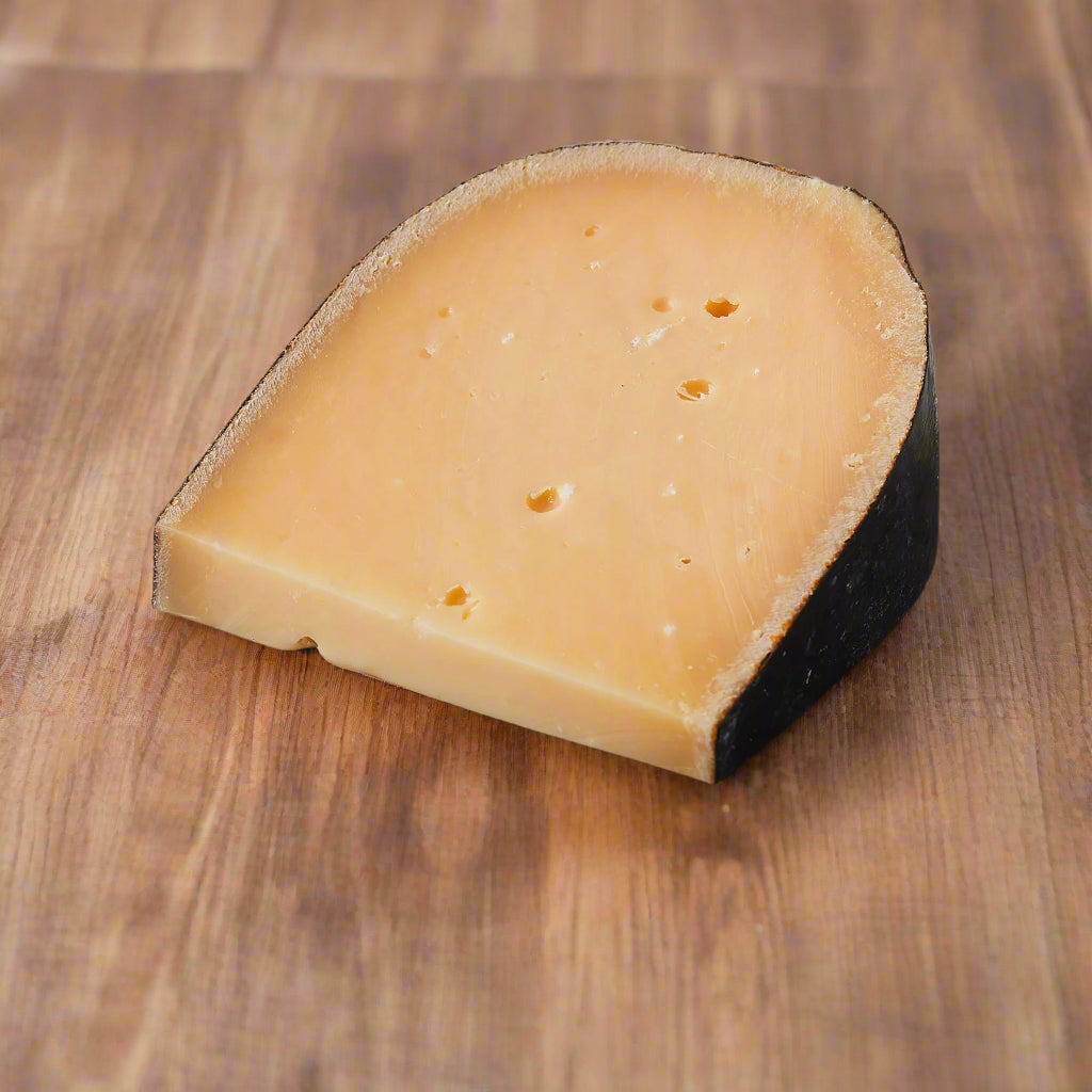 wedge of cheese, yellow paste, small holes throughout