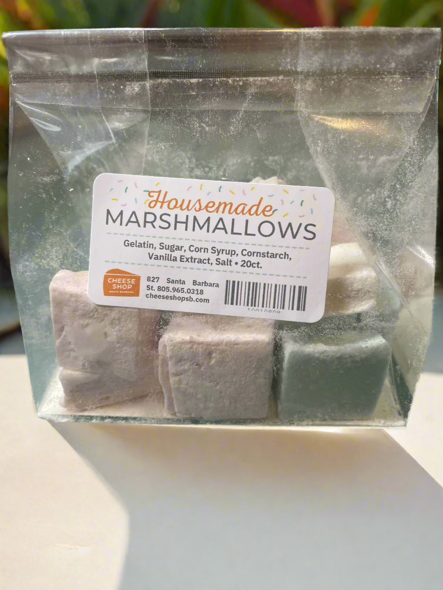 Housemade marshmallow cubes in pink/ blue/ and white, in a translucent cellophane bag