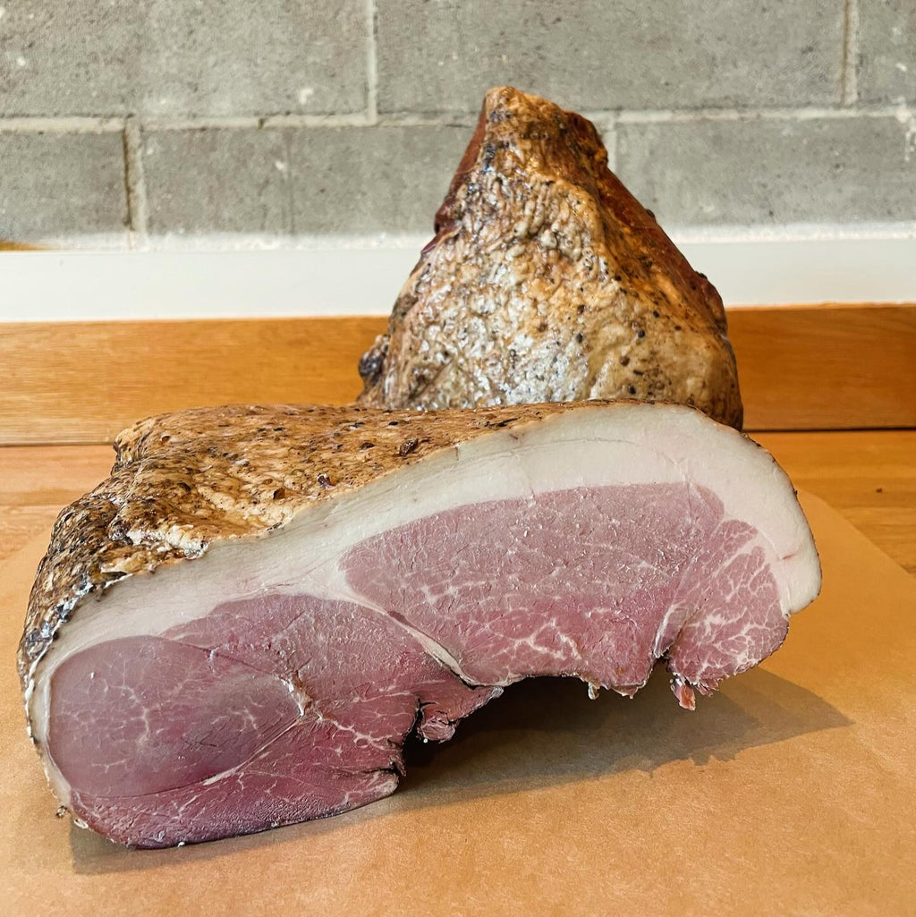 two blocks of ham, with visible fat marbling