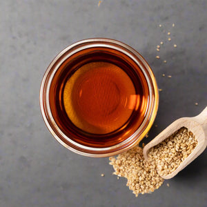 small glass of sesame oil, birdseye view