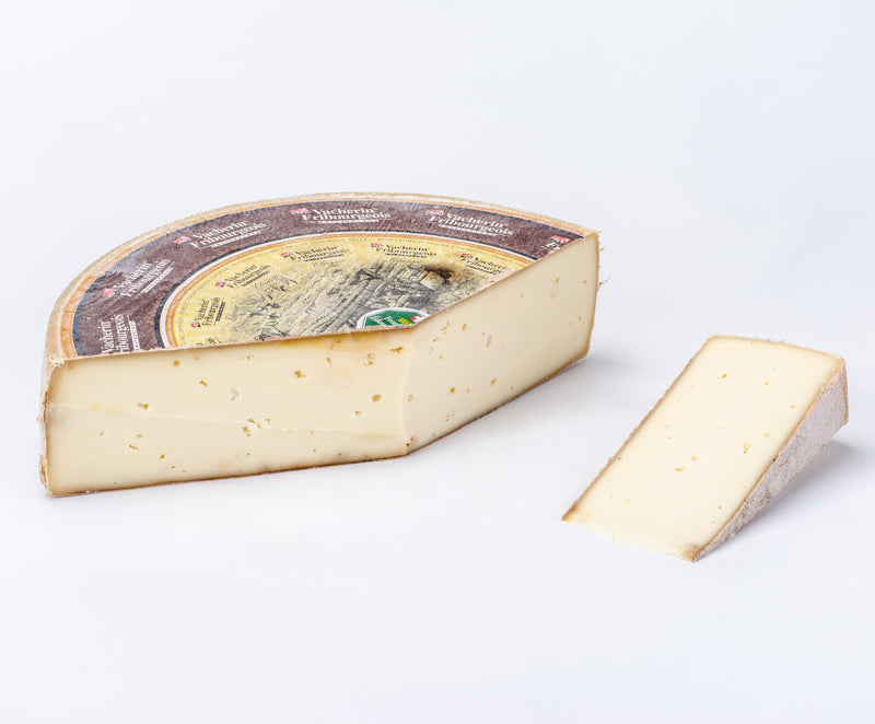 Large wheel of firm alpine cheese